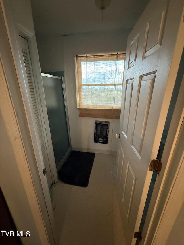 14313 Sandy Ridge Rd, Saint Paul, VA 24283 - full bathroom featuring heating unit, a shower stall, tile patterned flooring, and a closet