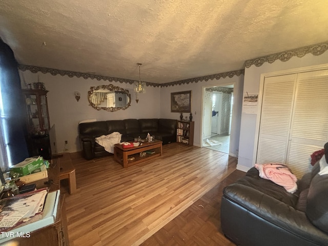 14313 Sandy Ridge Rd, Saint Paul, VA 24283 - living room featuring a textured ceiling and wood finished floors