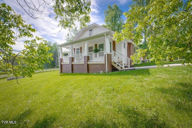 3901 Rocky Hill Ln, Kingsport, TN 37660 - back of property with covered porch, a yard, and stairway