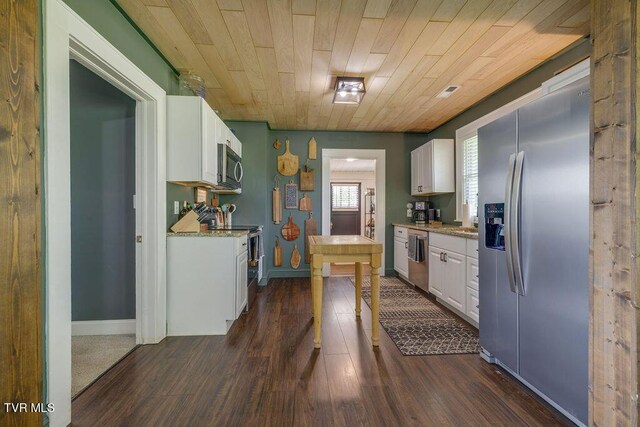 3901 Rocky Hill Ln, Kingsport, TN 37660 - kitchen featuring appliances with stainless steel finishes, white cabinets, dark wood-style floors, wooden ceiling, and light stone countertops