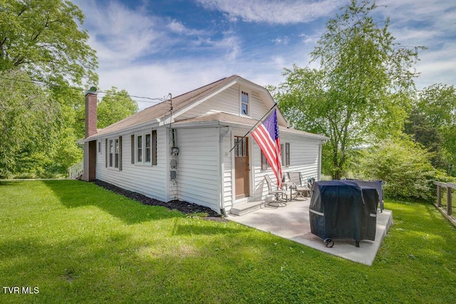 3901 Rocky Hill Ln, Kingsport, TN 37660 - back of property featuring a chimney, a patio area, and a yard