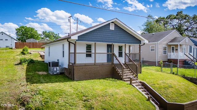 523 W Main St, Johnson City, TN 37604 - bungalow-style home featuring central AC unit, a porch, and stairs