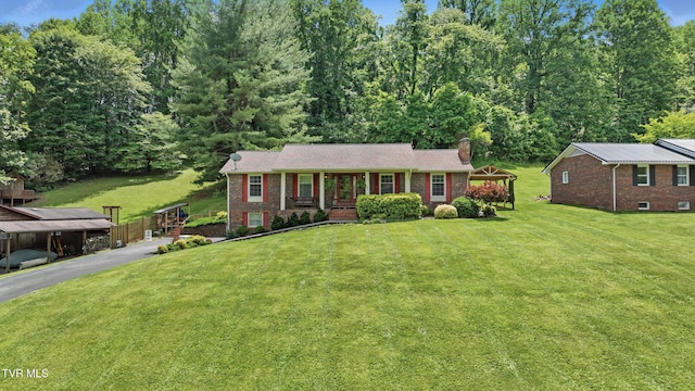 5009 Surrey Dr, Kingsport, TN 37664 - single story home featuring a chimney, brick siding, a front yard, driveway, and a gazebo