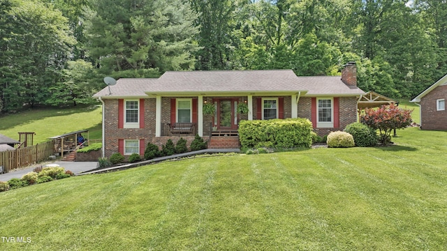 5009 Surrey Dr, Kingsport, TN 37664 - view of front of property featuring brick siding, a chimney, and covered porch