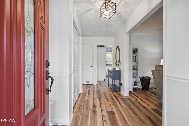 5009 Surrey Dr, Kingsport, TN 37664 - foyer featuring wood finished floors, stairs, and a textured ceiling