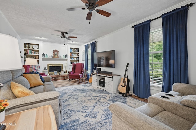 5009 Surrey Dr, Kingsport, TN 37664 - living room with a ceiling fan, a textured ceiling, wood finished floors, built in features, and crown molding