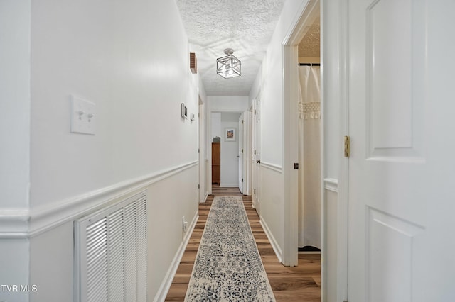 5009 Surrey Dr, Kingsport, TN 37664 - corridor featuring a textured ceiling and wood finished floors