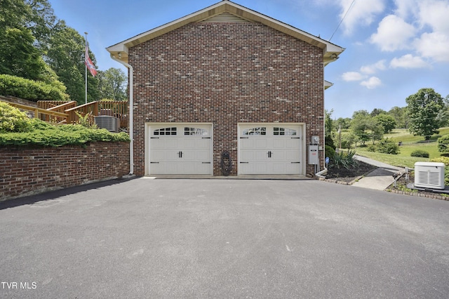 5009 Surrey Dr, Kingsport, TN 37664 - view of side of home with driveway, brick siding, and an attached garage