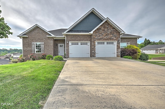 1030 Savin Fls, Gray, TN 37615 - craftsman house featuring a garage, a front yard, driveway, and brick siding