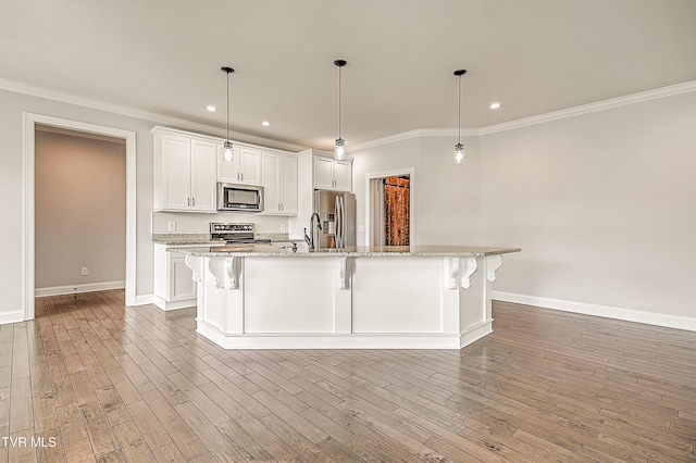 1030 Savin Fls, Gray, TN 37615 - kitchen with stainless steel appliances, baseboards, white cabinets, ornamental molding, and recessed lighting