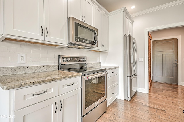 1030 Savin Fls, Gray, TN 37615 - kitchen featuring stainless steel appliances, white cabinets, ornamental molding, backsplash, and light wood finished floors