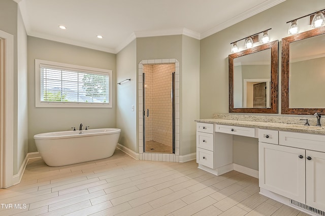 1030 Savin Fls, Gray, TN 37615 - full bathroom with vanity, a freestanding tub, crown molding, a shower stall, and baseboards