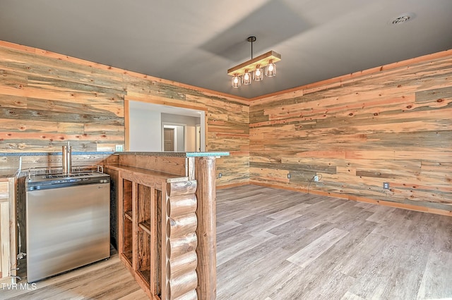 1030 Savin Fls, Gray, TN 37615 - bar area featuring stainless steel fridge, wood walls, and wood finished floors