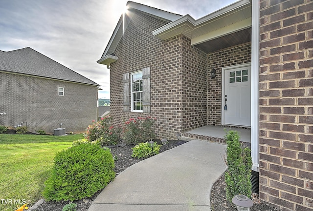 1030 Savin Fls, Gray, TN 37615 - property entrance featuring brick siding, a lawn, and central AC