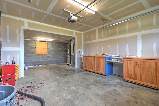 1030 Savin Fls, Gray, TN 37615 - garage with a garage door opener and concrete block wall