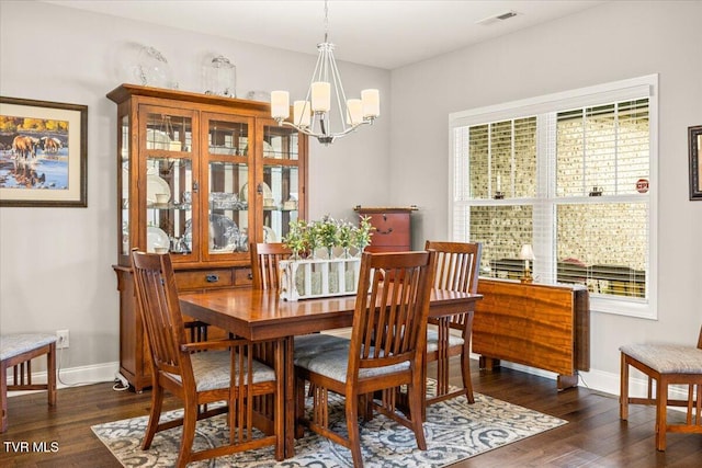 3321 Cottage Green Ct, Kingsport, TN 37664 - dining space with a chandelier, wood finished floors, and baseboards