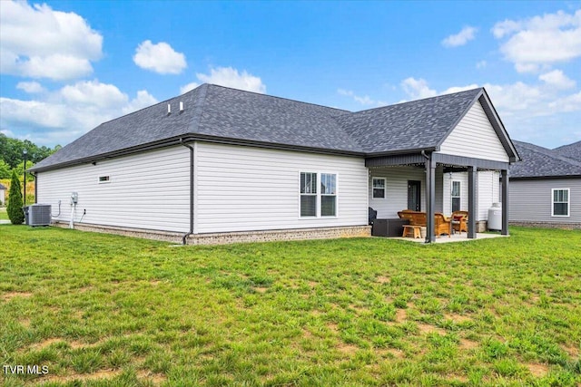 3321 Cottage Green Ct, Kingsport, TN 37664 - back of property featuring a patio, a lawn, cooling unit, and a shingled roof