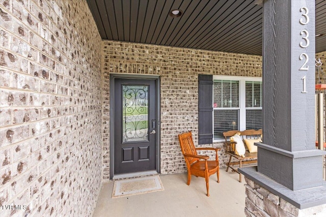3321 Cottage Green Ct, Kingsport, TN 37664 - doorway to property featuring brick siding and a porch
