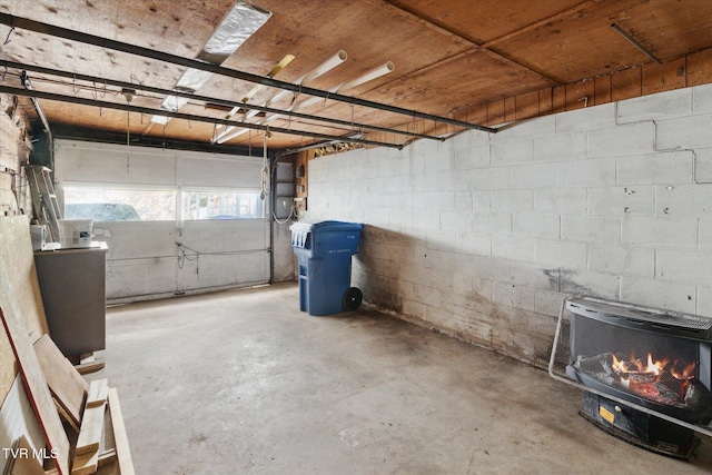 204 Maple Dr, Jonesborough, TN 37659 - garage with a wood stove and concrete block wall