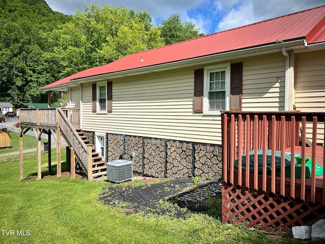 326 Park Ave, Appalachia, VA 24216 - rear view of house featuring a deck, metal roof, a lawn, stairs, and central AC unit