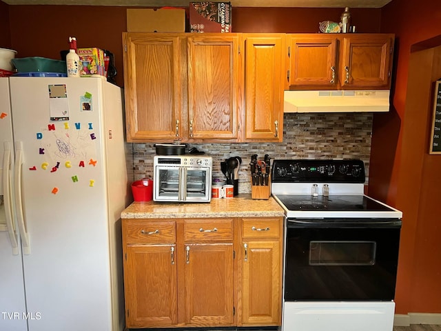 326 Park Ave, Appalachia, VA 24216 - kitchen with white refrigerator with ice dispenser, under cabinet range hood, range with electric stovetop, and decorative backsplash