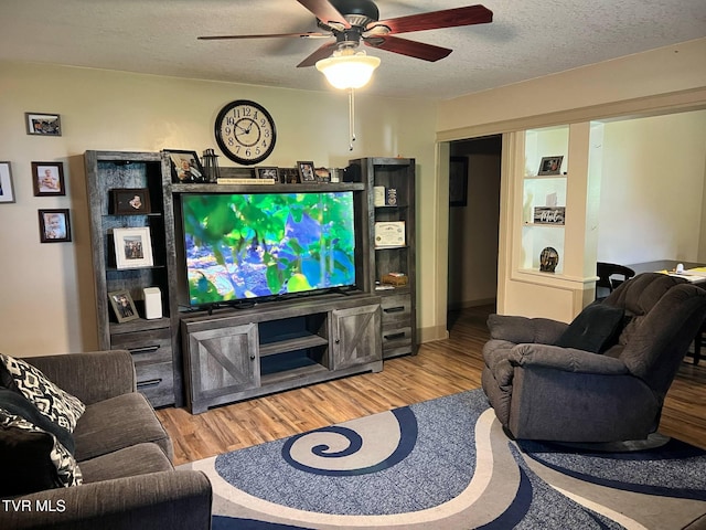 326 Park Ave, Appalachia, VA 24216 - living room featuring a ceiling fan, wood finished floors, and a textured ceiling