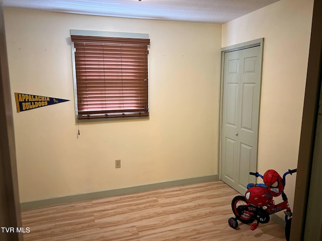326 Park Ave, Appalachia, VA 24216 - unfurnished bedroom with light wood-style flooring, a closet, and baseboards
