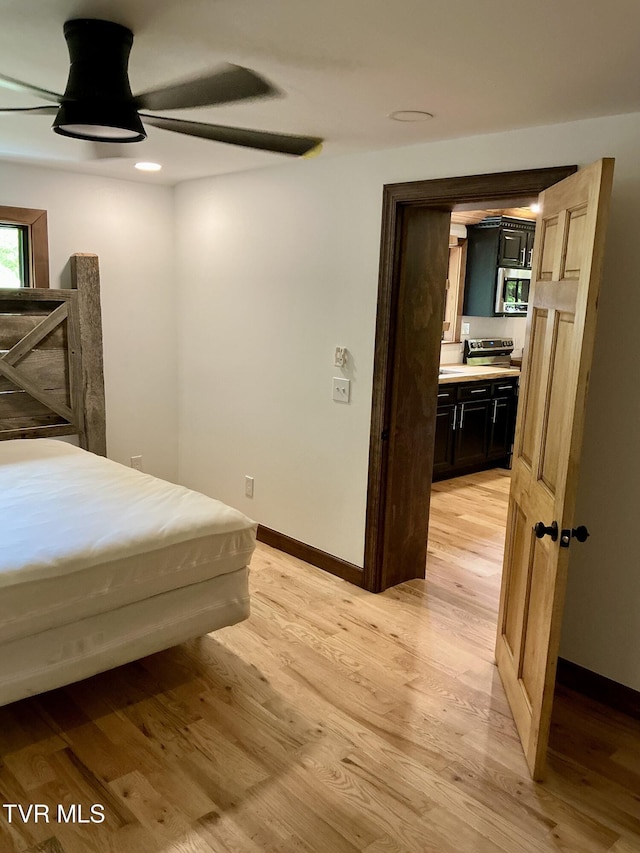 153 Hampton Creek Rd, Roan Mountain, TN 37687 - bedroom with light wood-type flooring, baseboards, recessed lighting, connected bathroom, and a ceiling fan