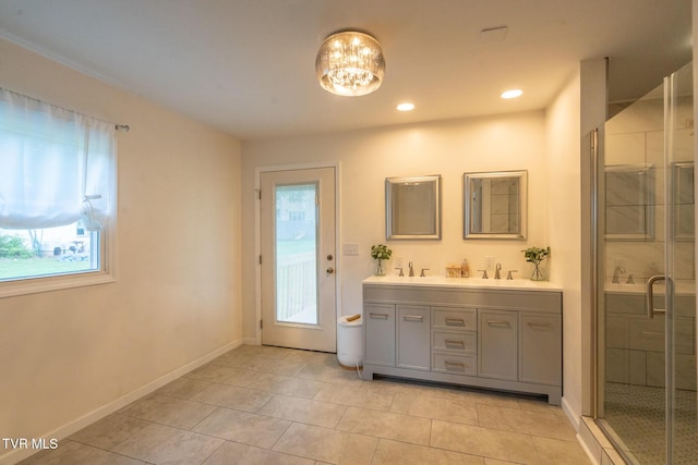 1318 E Lakeview Dr, Johnson City, TN 37601 - bathroom featuring plenty of natural light, double vanity, a stall shower, tile patterned flooring, and recessed lighting