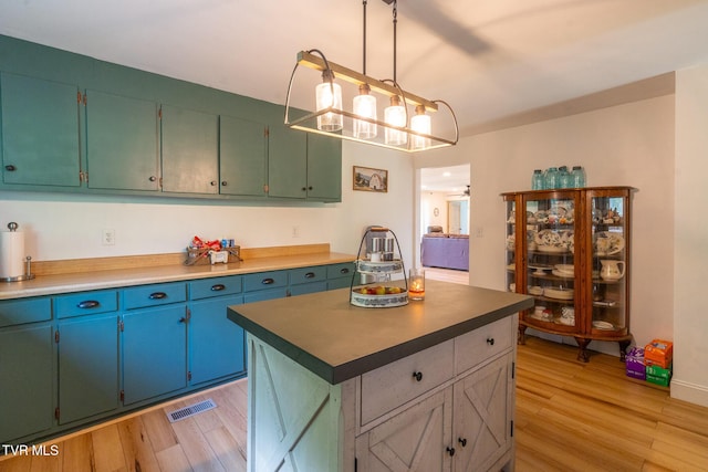 1318 E Lakeview Dr, Johnson City, TN 37601 - kitchen with light wood finished floors, decorative light fixtures, and a kitchen island