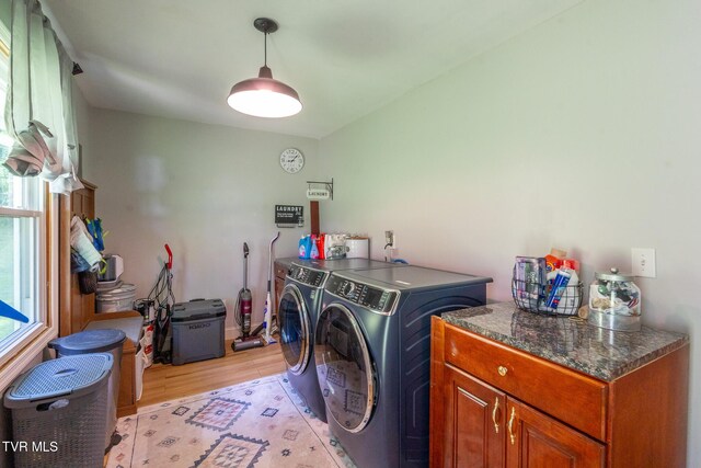 1318 E Lakeview Dr, Johnson City, TN 37601 - laundry area featuring washing machine and clothes dryer, light wood-style floors, and cabinet space