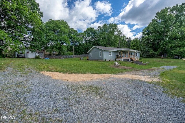 1318 E Lakeview Dr, Johnson City, TN 37601 - view of front of house featuring driveway, view of wooded area, and a wooden deck