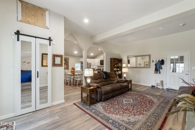 2087 Fodderstack Mountain Loop, Greeneville, TN 37745 - living room featuring a barn door, light wood-type flooring, recessed lighting, and baseboards