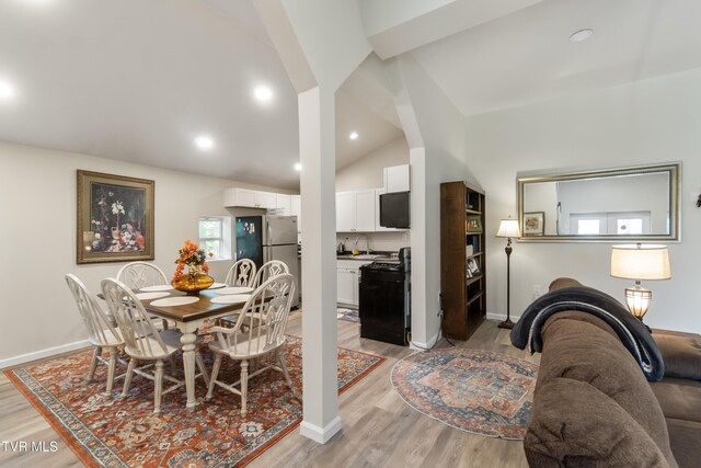 2087 Fodderstack Mountain Loop, Greeneville, TN 37745 - dining room featuring vaulted ceiling, light wood-style floors, and baseboards