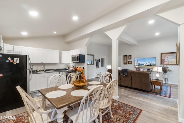 2087 Fodderstack Mountain Loop, Greeneville, TN 37745 - dining room with light wood-type flooring, lofted ceiling, recessed lighting, baseboards, and ornate columns