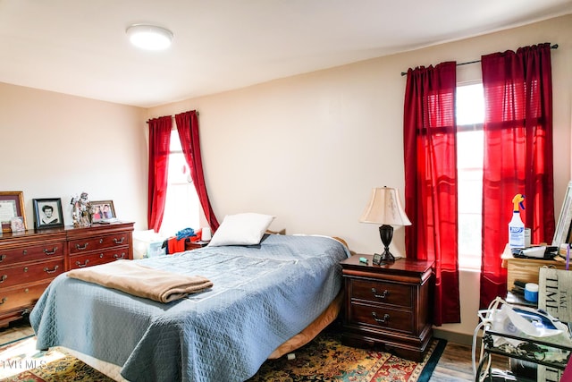 2087 Fodderstack Mountain Loop, Greeneville, TN 37745 - bedroom featuring multiple windows and wood finished floors
