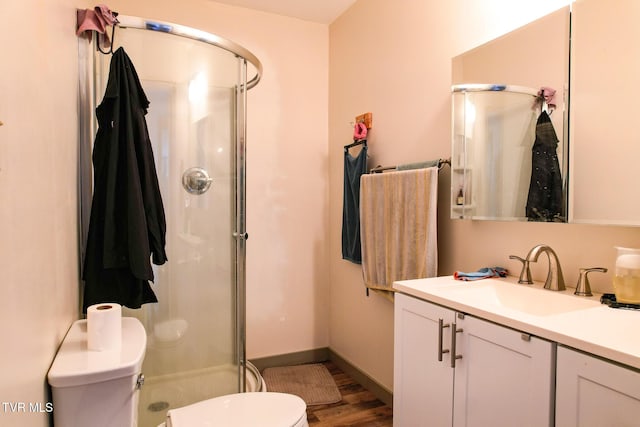 2087 Fodderstack Mountain Loop, Greeneville, TN 37745 - bathroom featuring toilet, a shower stall, vanity, and wood finished floors