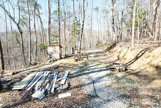 2087 Fodderstack Mountain Loop, Greeneville, TN 37745 - view of yard featuring an outdoor structure and a view of trees