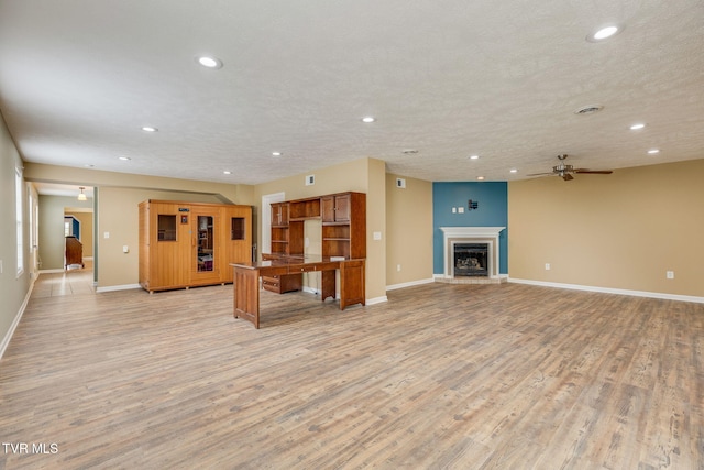 516 Bowmantown Rd, Telford, TN 37690 - unfurnished living room with recessed lighting, ceiling fan, light wood-style floors, and baseboards