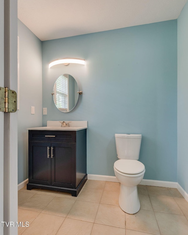 516 Bowmantown Rd, Telford, TN 37690 - bathroom with toilet, vanity, tile patterned flooring, and baseboards