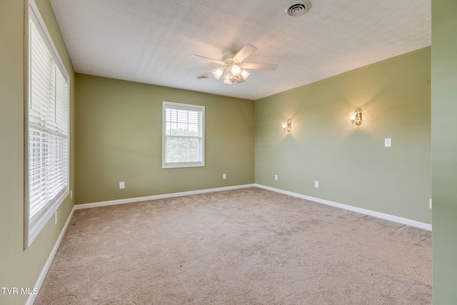 516 Bowmantown Rd, Telford, TN 37690 - carpeted empty room featuring a ceiling fan, baseboards, and a textured ceiling