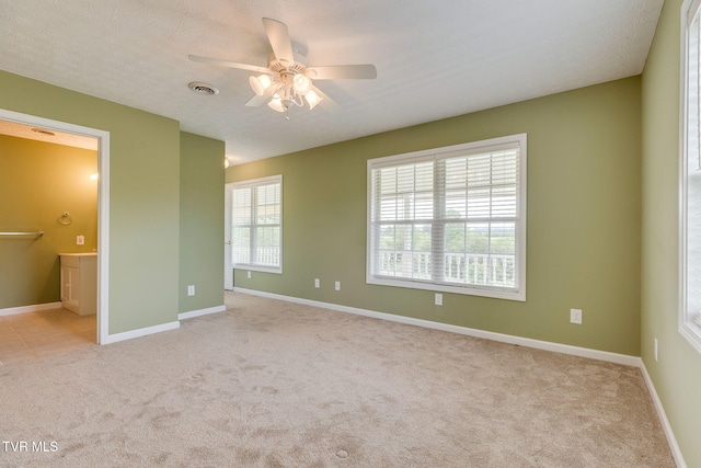 516 Bowmantown Rd, Telford, TN 37690 - unfurnished bedroom with carpet flooring, baseboards, connected bathroom, and ceiling fan