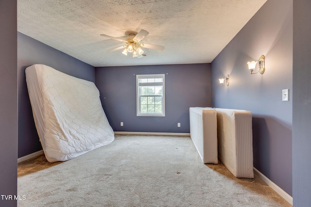 516 Bowmantown Rd, Telford, TN 37690 - unfurnished bedroom featuring carpet, a textured ceiling, baseboards, and a ceiling fan