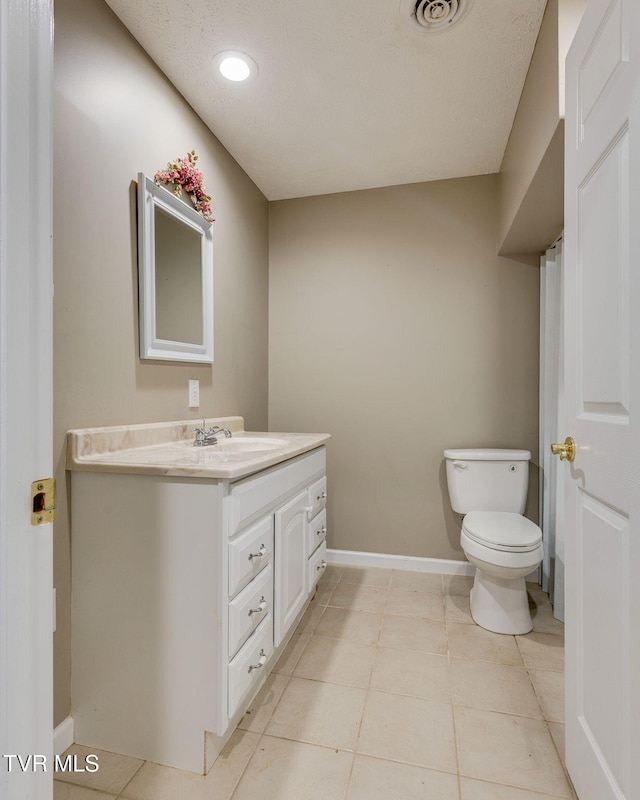 516 Bowmantown Rd, Telford, TN 37690 - bathroom with vanity, toilet, baseboards, tile patterned floors, and recessed lighting