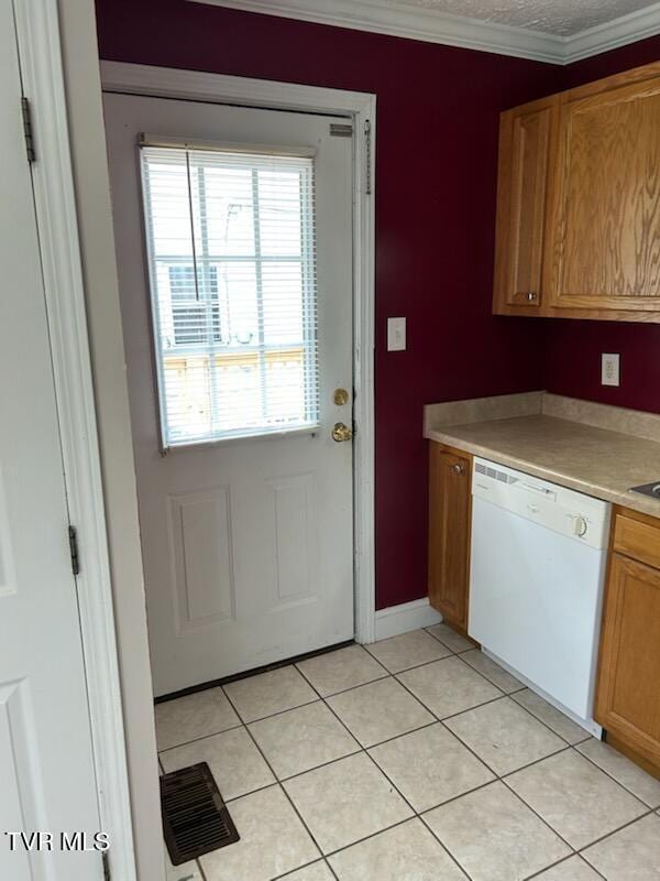1657 Redwood Dr, Kingsport, TN 37664 - kitchen with dishwasher, light countertops, light tile patterned floors, crown molding, and baseboards