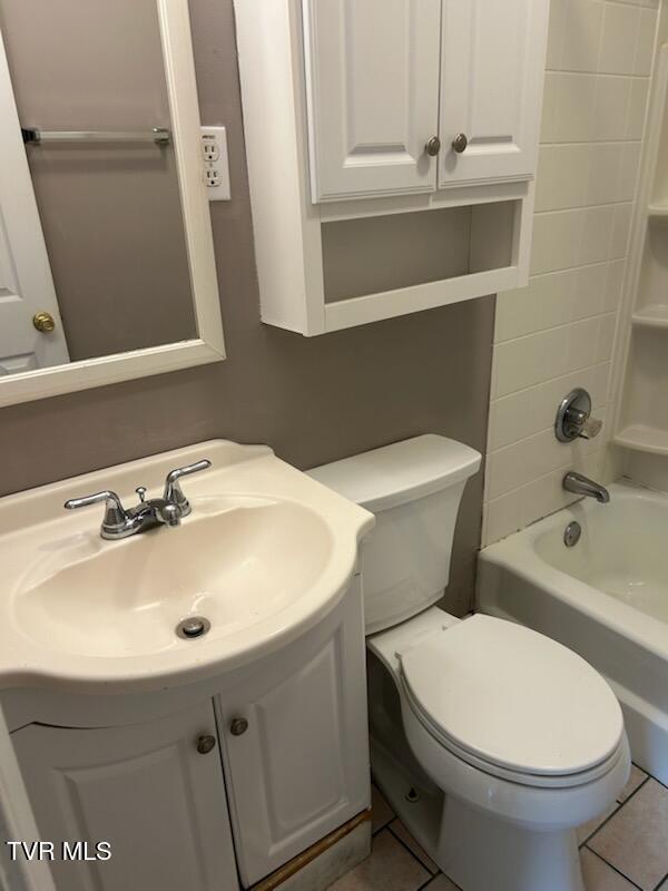1657 Redwood Dr, Kingsport, TN 37664 - full bathroom with shower / bathtub combination, vanity, toilet, and tile patterned flooring