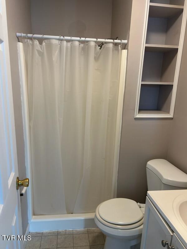 1657 Redwood Dr, Kingsport, TN 37664 - bathroom with toilet, vanity, curtained shower, and tile patterned flooring