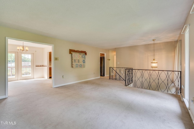 206 Windmere Pl, Kingsport, TN 37663 - carpeted empty room featuring a chandelier and baseboards