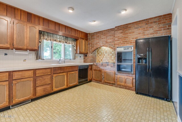 206 Windmere Pl, Kingsport, TN 37663 - kitchen with black appliances, a sink, a warming drawer, light floors, and tile counters