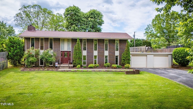 206 Windmere Pl, Kingsport, TN 37663 - split foyer home featuring driveway, a chimney, brick siding, and a garage